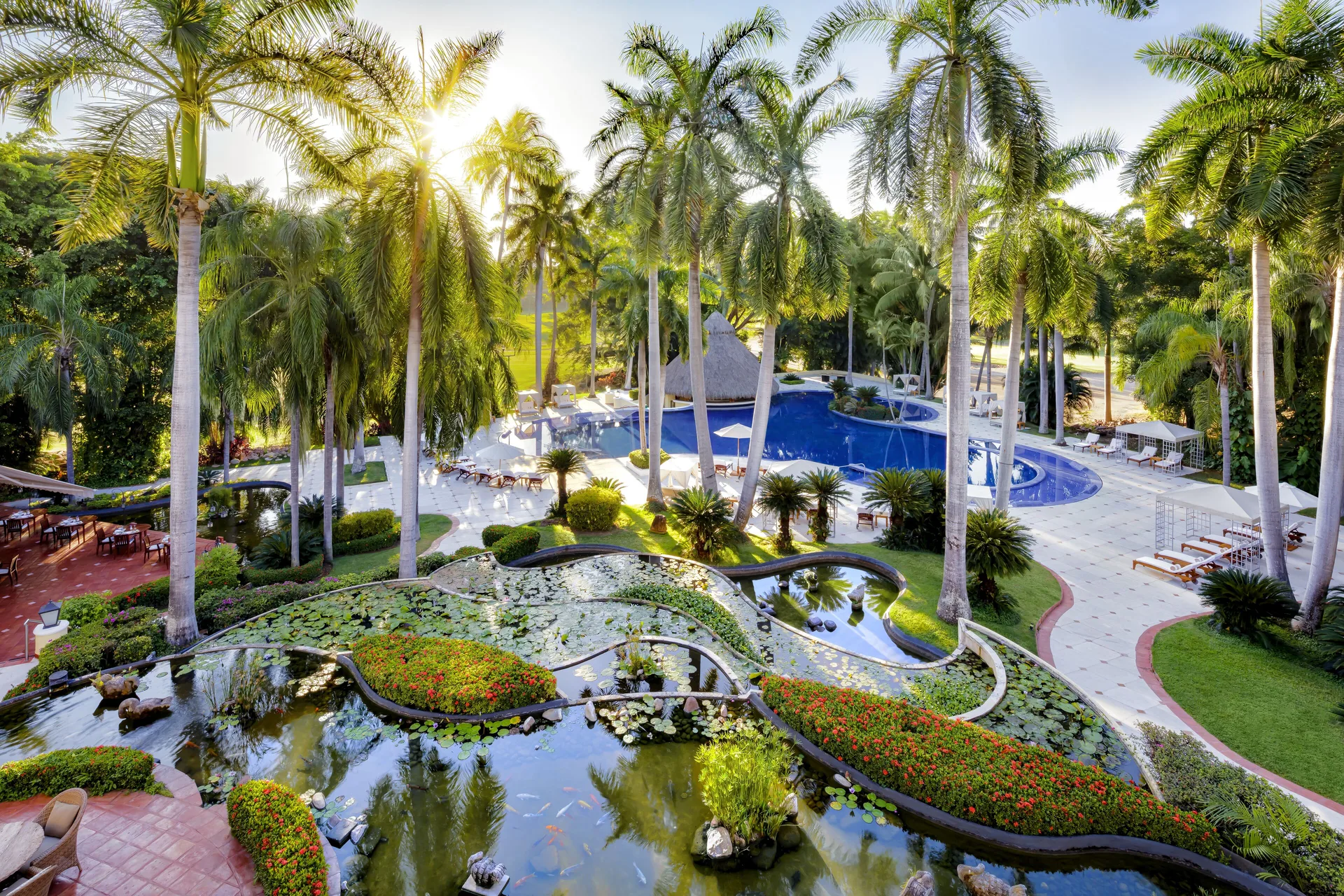 Aerial view of palm gardens, lily ponds, and the pool at Casa Velas.