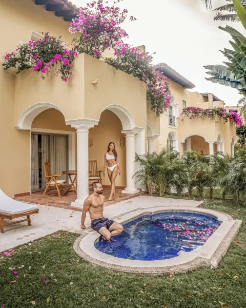 Terrace plunge pool beside arched suite patios and bougainvillea at Casa Velas.