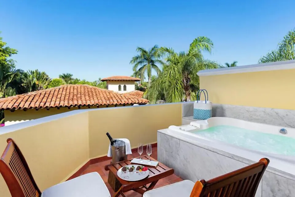 Master Suite Plus terrace with whirlpool tub and lounge chairs at Casa Velas.