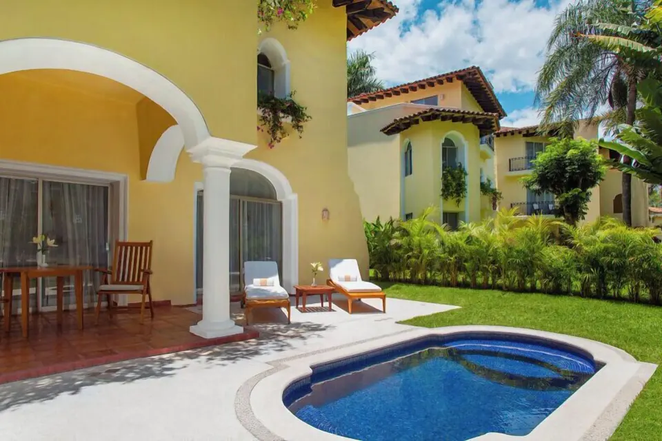 One Bedroom Ambassador Suite patio with loungers and private pool at Casa Velas.