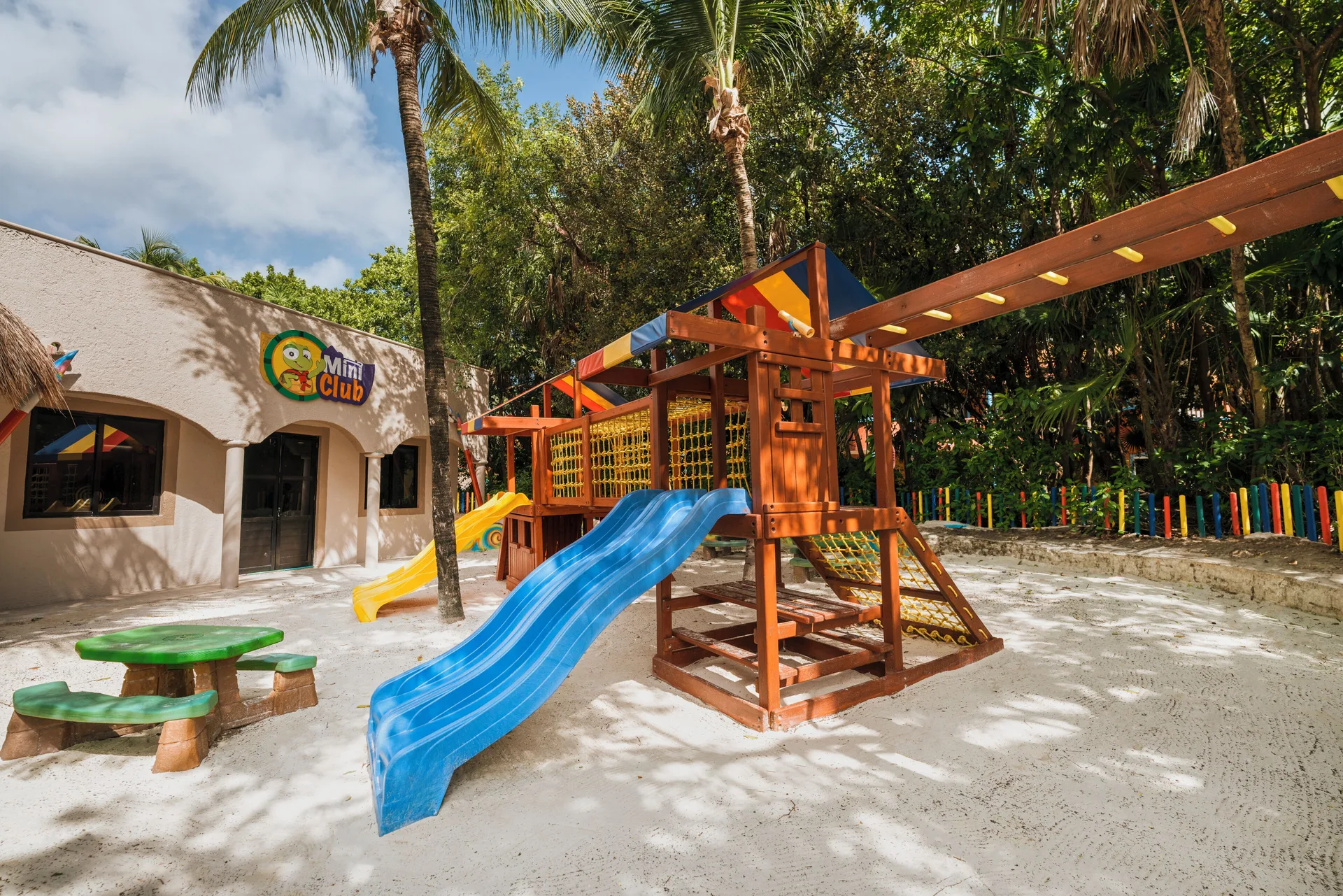 Mini Club playground with slides and climbing equipment at Catalonia Playa Maroma.