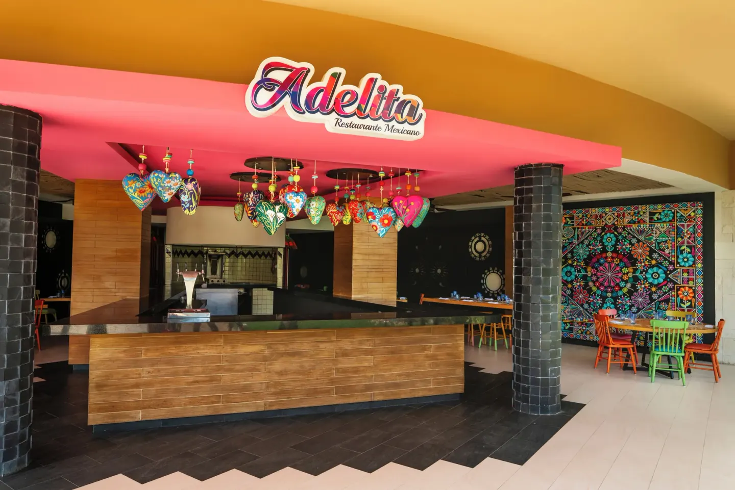 Adelita Mexican restaurant entrance with colorful decor at Catalonia Playa Maroma.