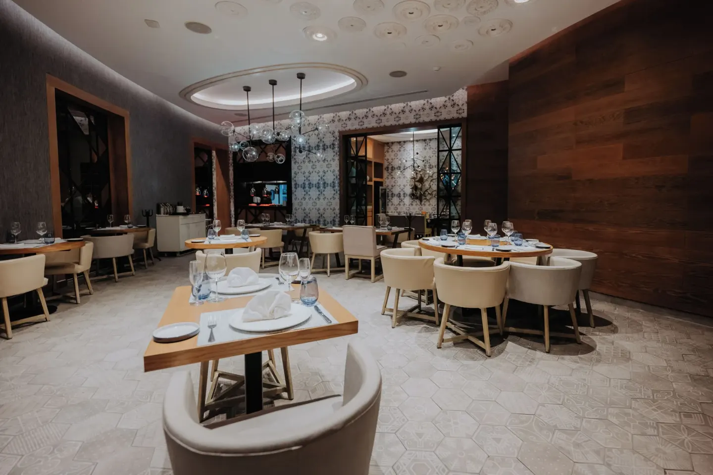 Elegant restaurant dining room with set tables at Catalonia Playa Maroma.