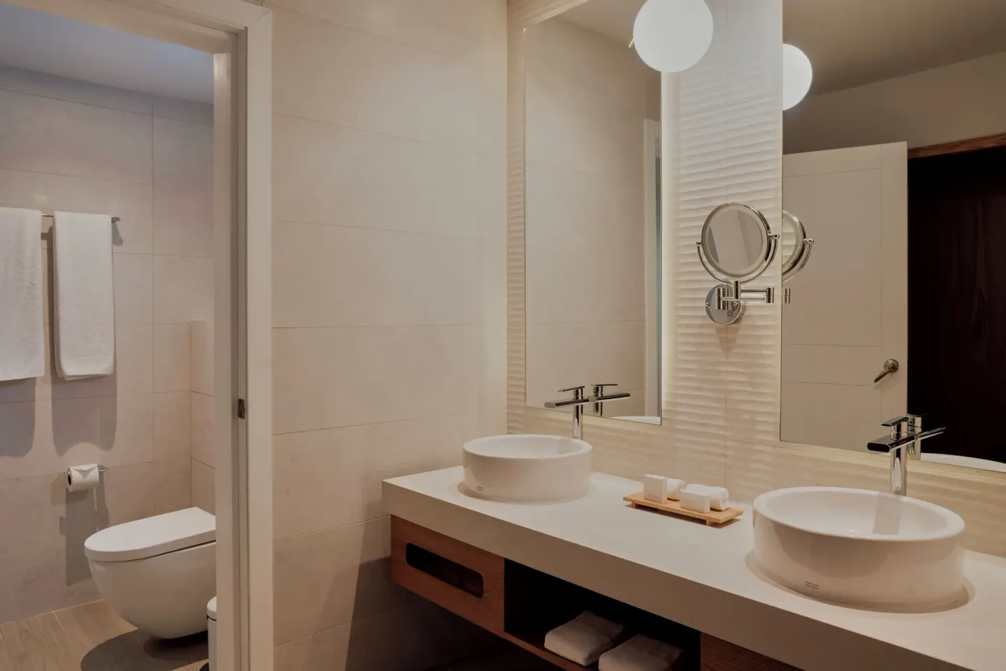 Premium Deluxe Room bathroom with double sinks at Catalonia Playa Maroma.