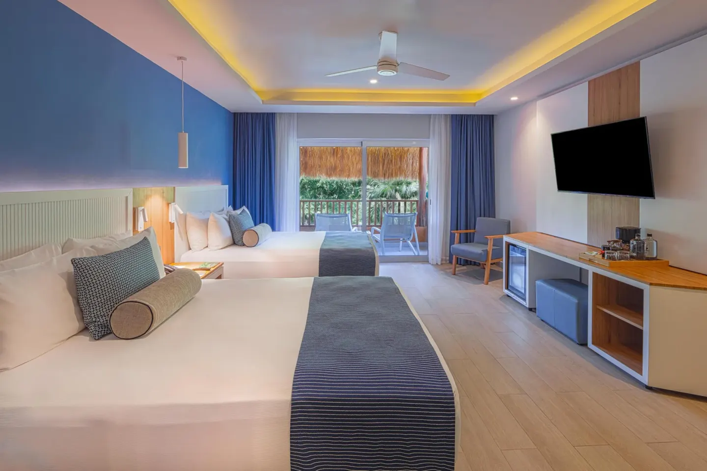 Premium Deluxe Room with two beds, TV and balcony view at Catalonia Playa Maroma.