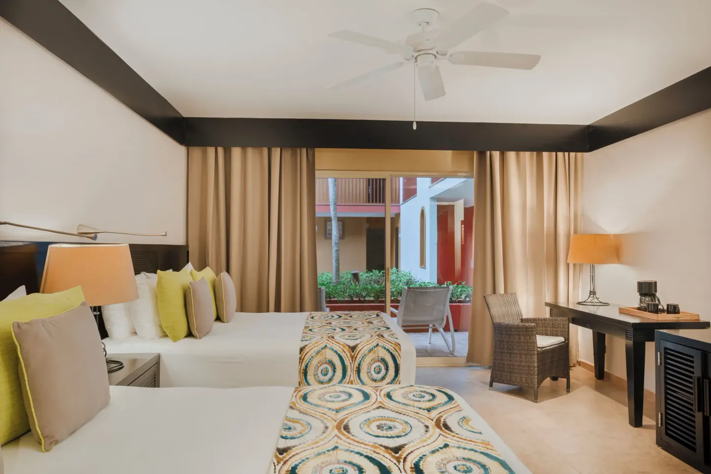 Premium Room with two beds and patio doors at Catalonia Playa Maroma.