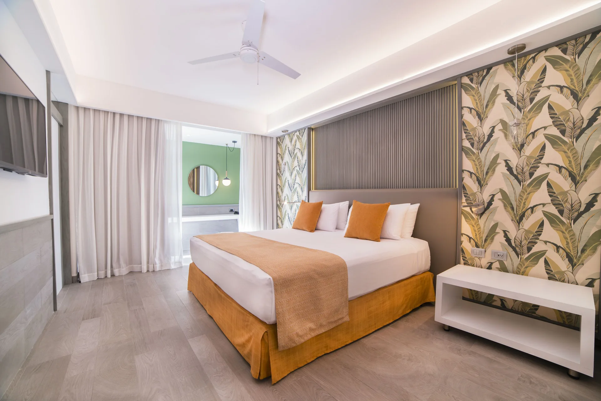 Privileged Suite Ocean View Swimming Pool king bed bedroom at Catalonia Playa Maroma with modern design and suite-style comfort on Playa Maroma.