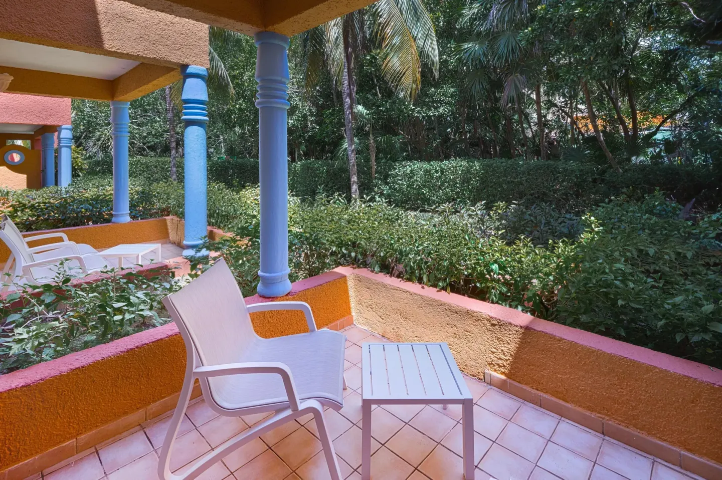 Privileged Superior terrace with chairs and garden view at Catalonia Playa Maroma.