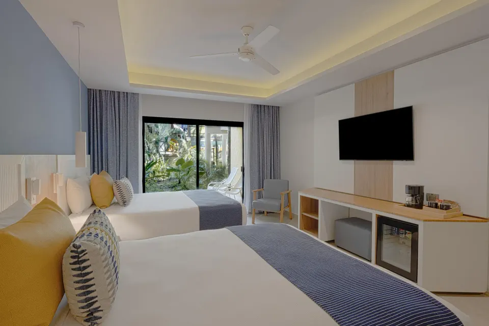 Double-bedded room with modern furnishings at Catalonia Riviera Maya Resort and Spa