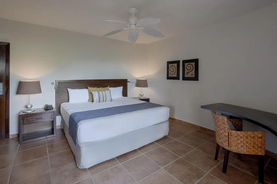 King guest room with desk and tiled floors at Catalonia Riviera Maya Resort and Spa