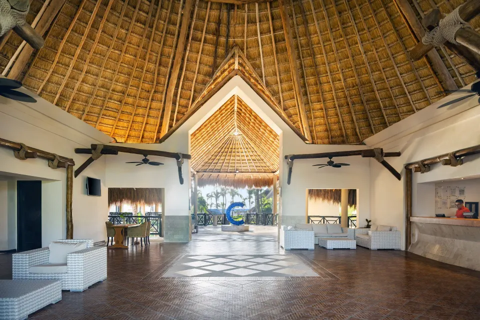 Open-air thatched-roof lobby entrance at Catalonia Riviera Maya Resort and Spa