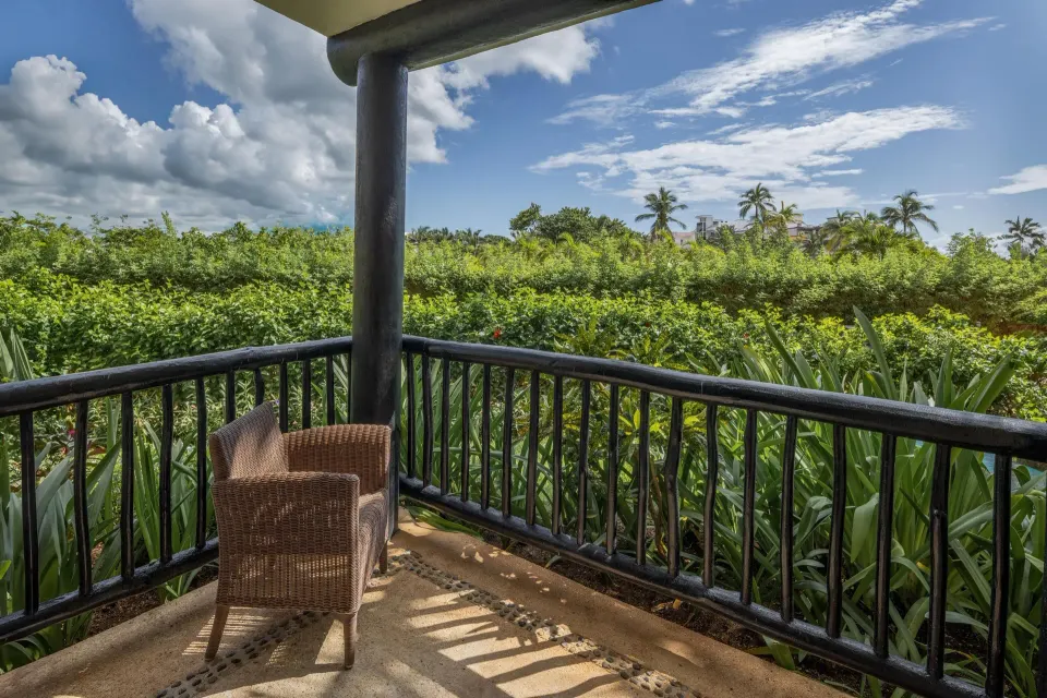 Shaded balcony overlooking dense tropical landscaping at Catalonia Riviera Maya Resort and Spa