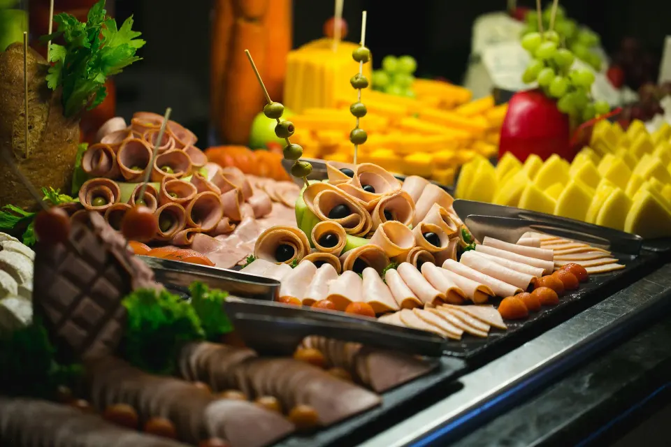 Cold buffet display of sliced meats and fruit at Catalonia Riviera Maya Resort and Spa