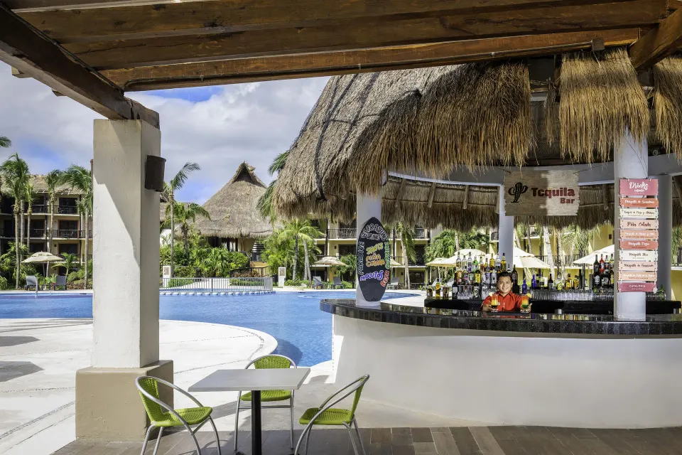 Swim-up palapa bar beside the main pool at Catalonia Riviera Maya Resort and Spa