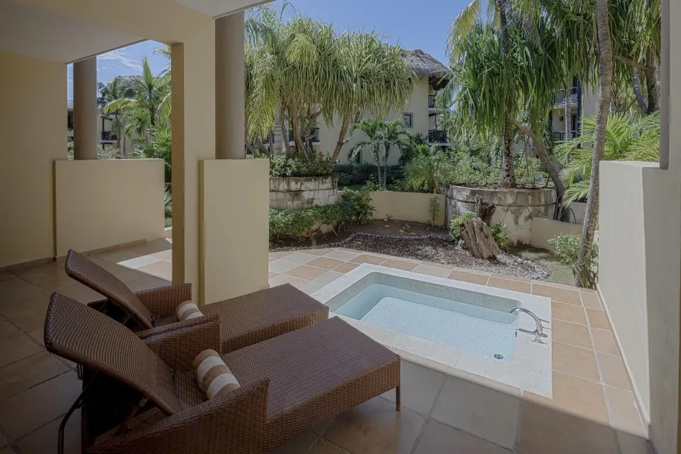 Private terrace with lounge chairs and plunge pool at a Privileged Family Suite at Catalonia Riviera Maya Resort and Spa