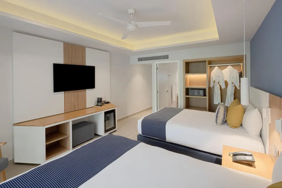 Privileged Premium Deluxe room view toward TV and closet at Catalonia Riviera Maya Resort and Spa