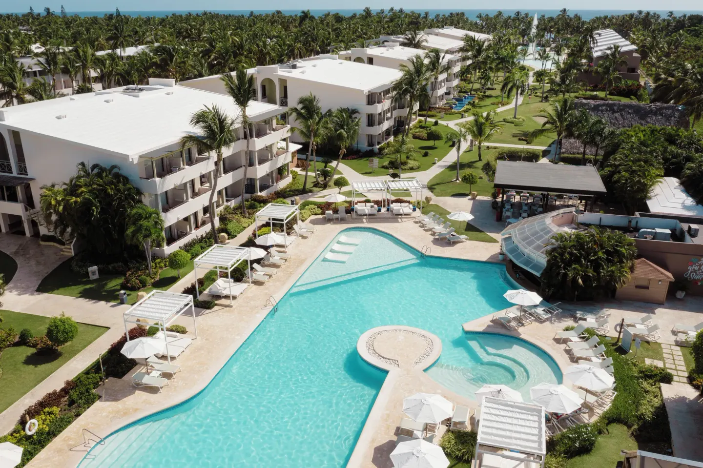 Aerial view of the main pool and resort buildings at Catalonia Royal Bavaro.
