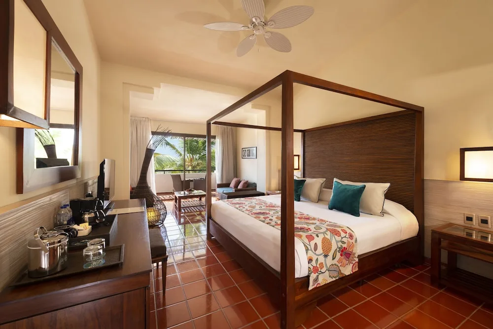 Junior Suite Superior with four-poster bed and balcony at Catalonia Royal Bavaro.