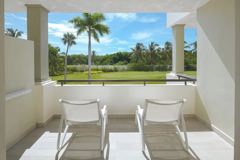 Premium Junior Suite balcony with two lounge chairs at Catalonia Royal Bavaro.