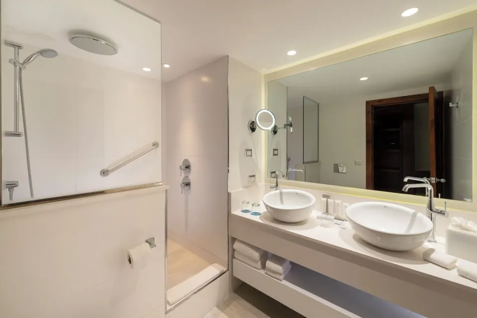 Premium Junior Suite bathroom with double sinks at Catalonia Royal Bavaro.