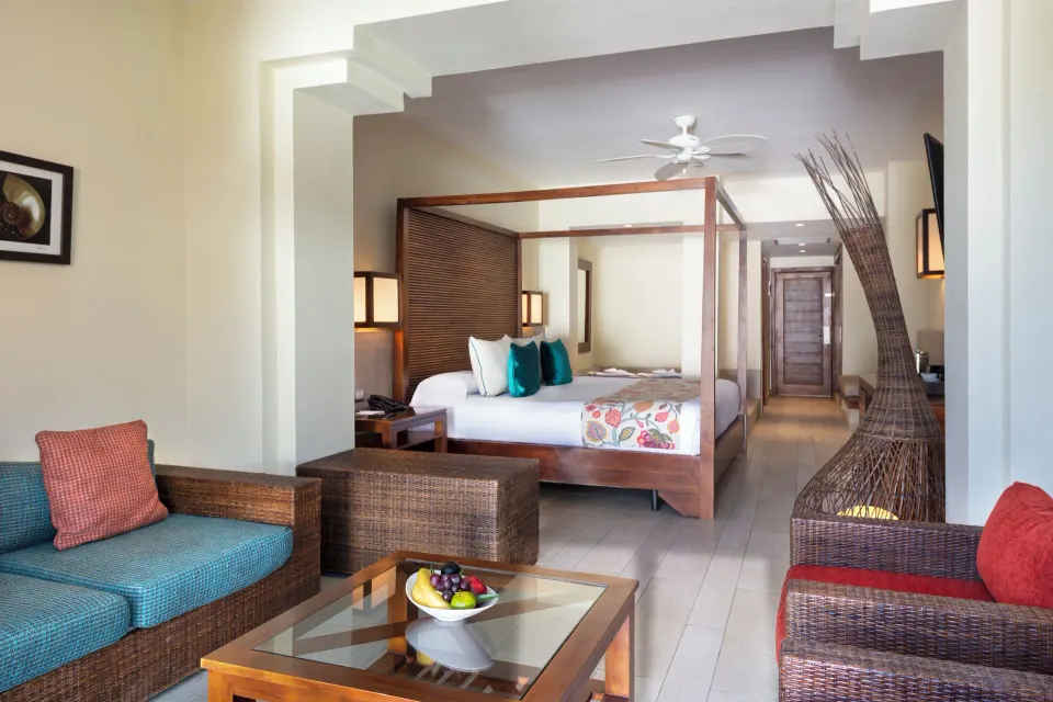 Premium Junior Suite sitting area and king bed at Catalonia Royal Bavaro.