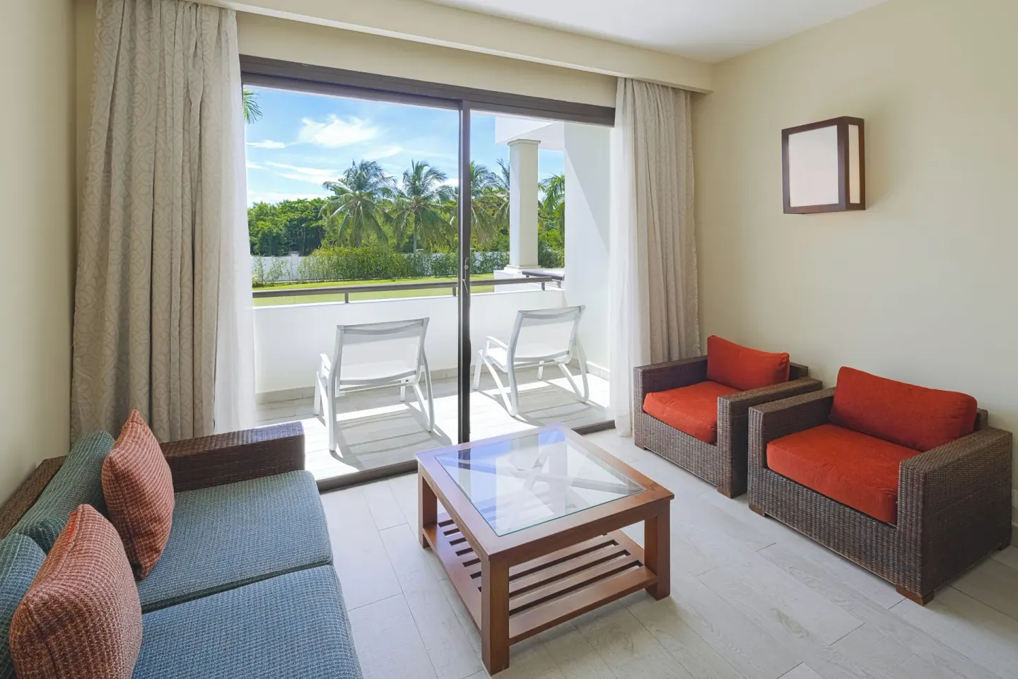 Premium Junior Suite lounge with balcony seating at Catalonia Royal Bavaro.