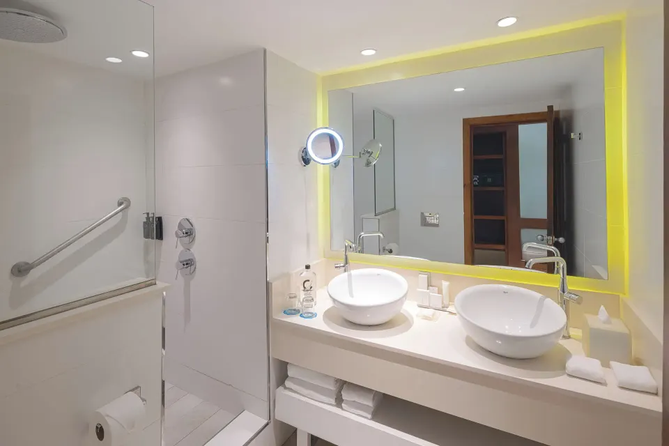 Privileged Deluxe Junior Suite bathroom with double sinks at Catalonia Royal Bavaro.
