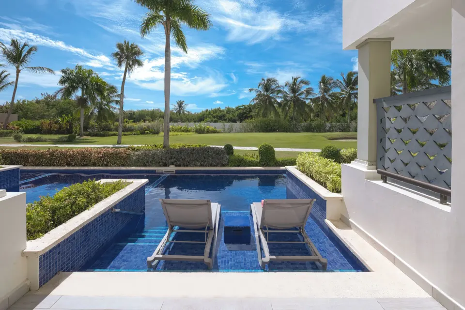 Privileged Deluxe Junior Suite swim-up terrace with loungers at Catalonia Royal Bavaro.