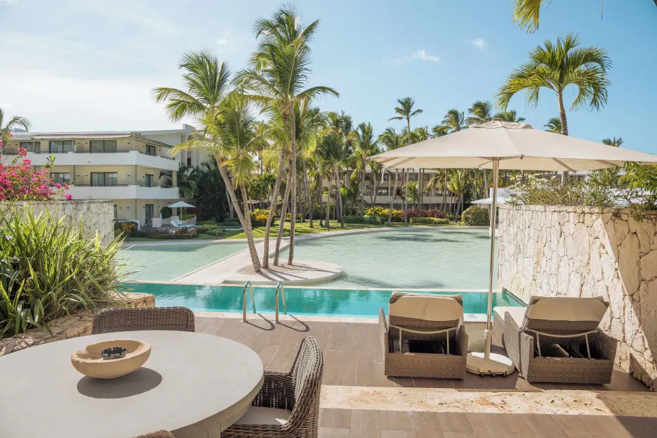Privileged Duplex Suite pool terrace with loungers at Catalonia Royal Bavaro.