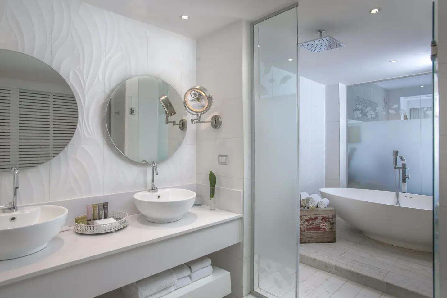 Privileged Romance Deluxe Junior Suite bathroom with sinks and tub at Catalonia Royal Bavaro.
