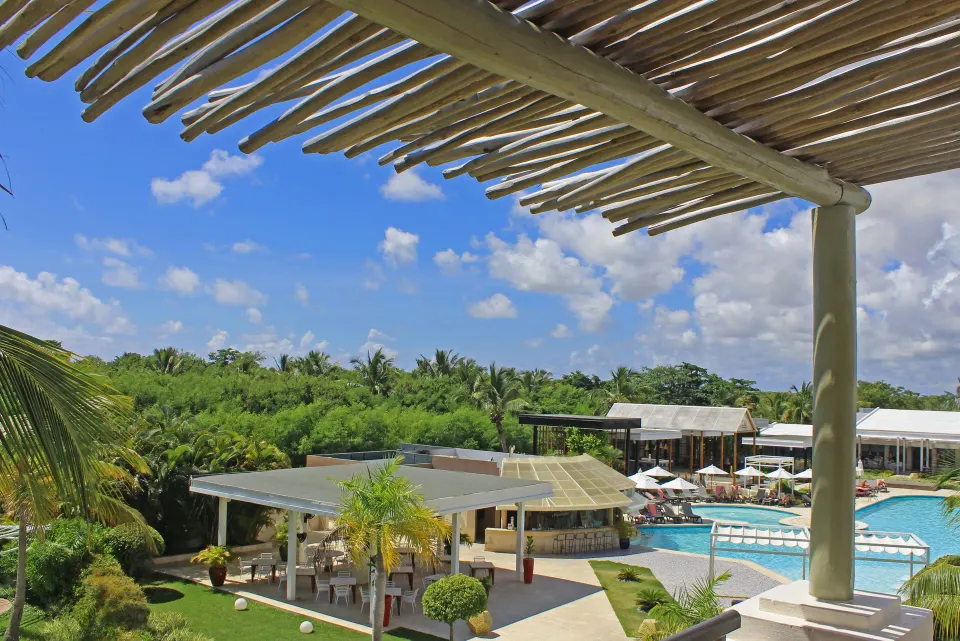 Superior Junior Suite balcony view over pool and gardens at Catalonia Royal Bavaro.