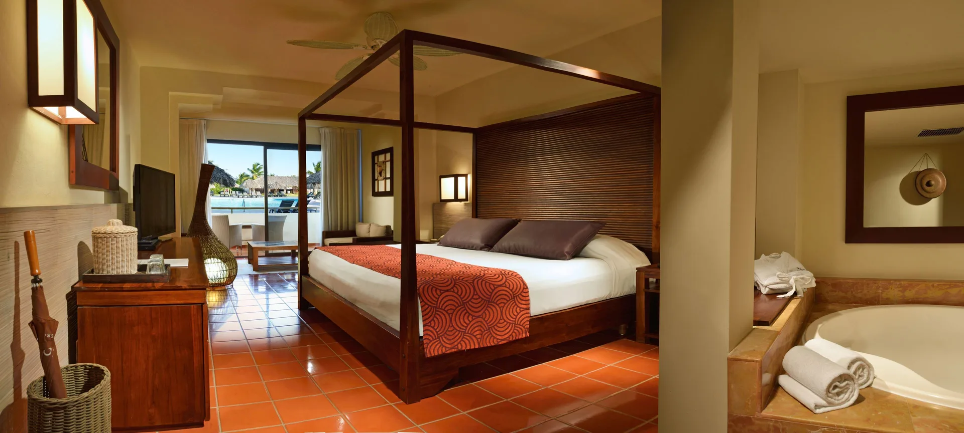 Superior Junior Suite with canopy bed and tub at Catalonia Royal Bavaro.