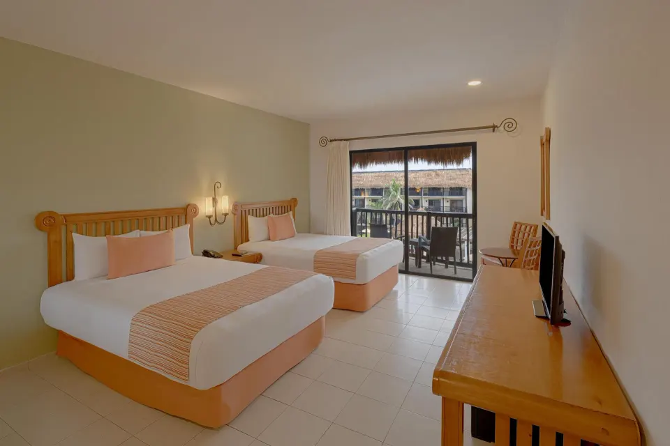 Spacious twin room with balcony at Catalonia Yucatan Beach.