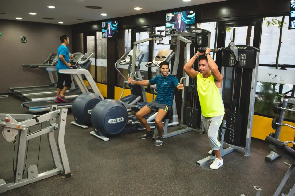 Guests working out in the fitness center at Catalonia Yucatan Beach