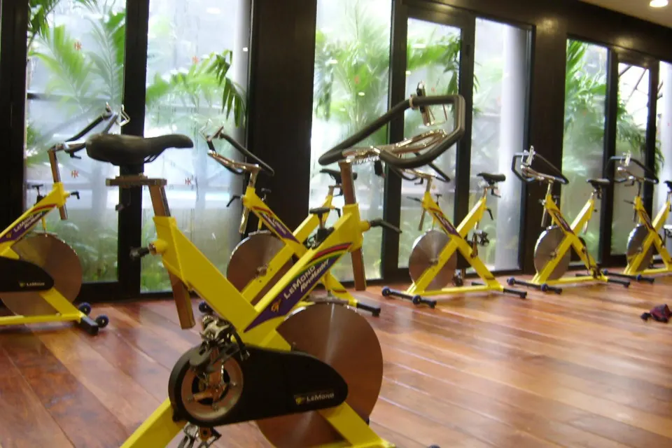 Indoor spinning bikes lined up in the fitness studio at Catalonia Yucatan Beach.