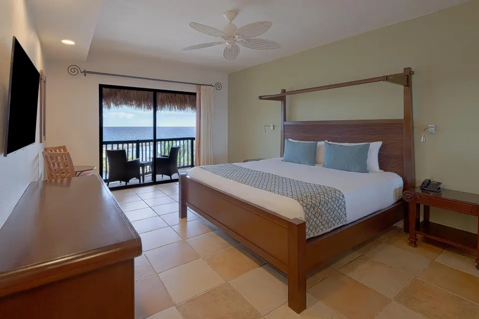 King room with balcony and ocean view at Catalonia Yucatan Beach.