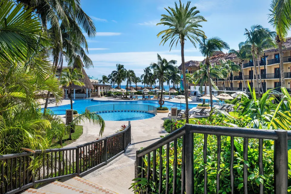 Resort pool and palm-lined grounds at Catalonia Yucatan Beach
