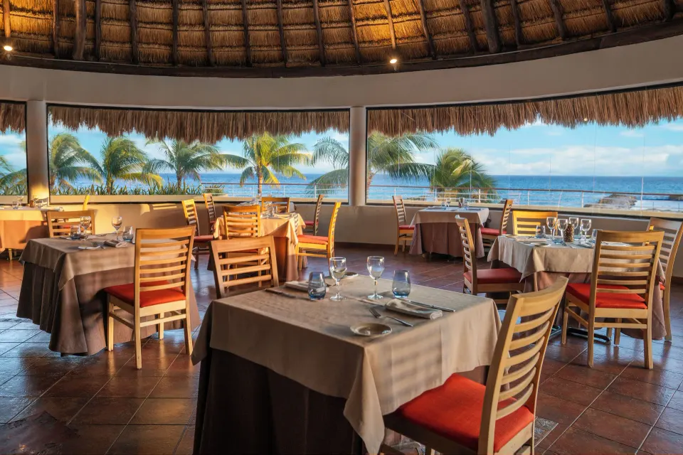 Open‑air dining area with ocean view at Catalonia Yucatan Beach