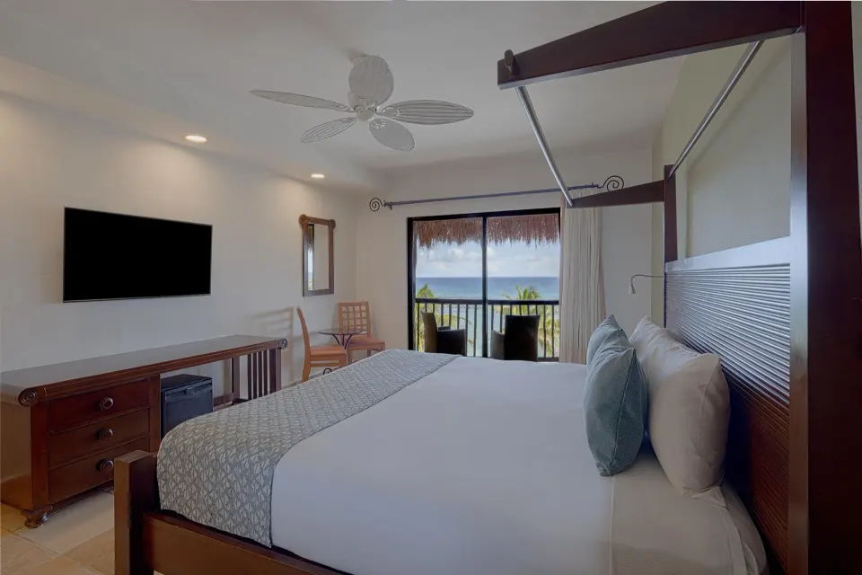 Premium Ocean Front Room king bed and balcony view at Catalonia Yucatan Beach