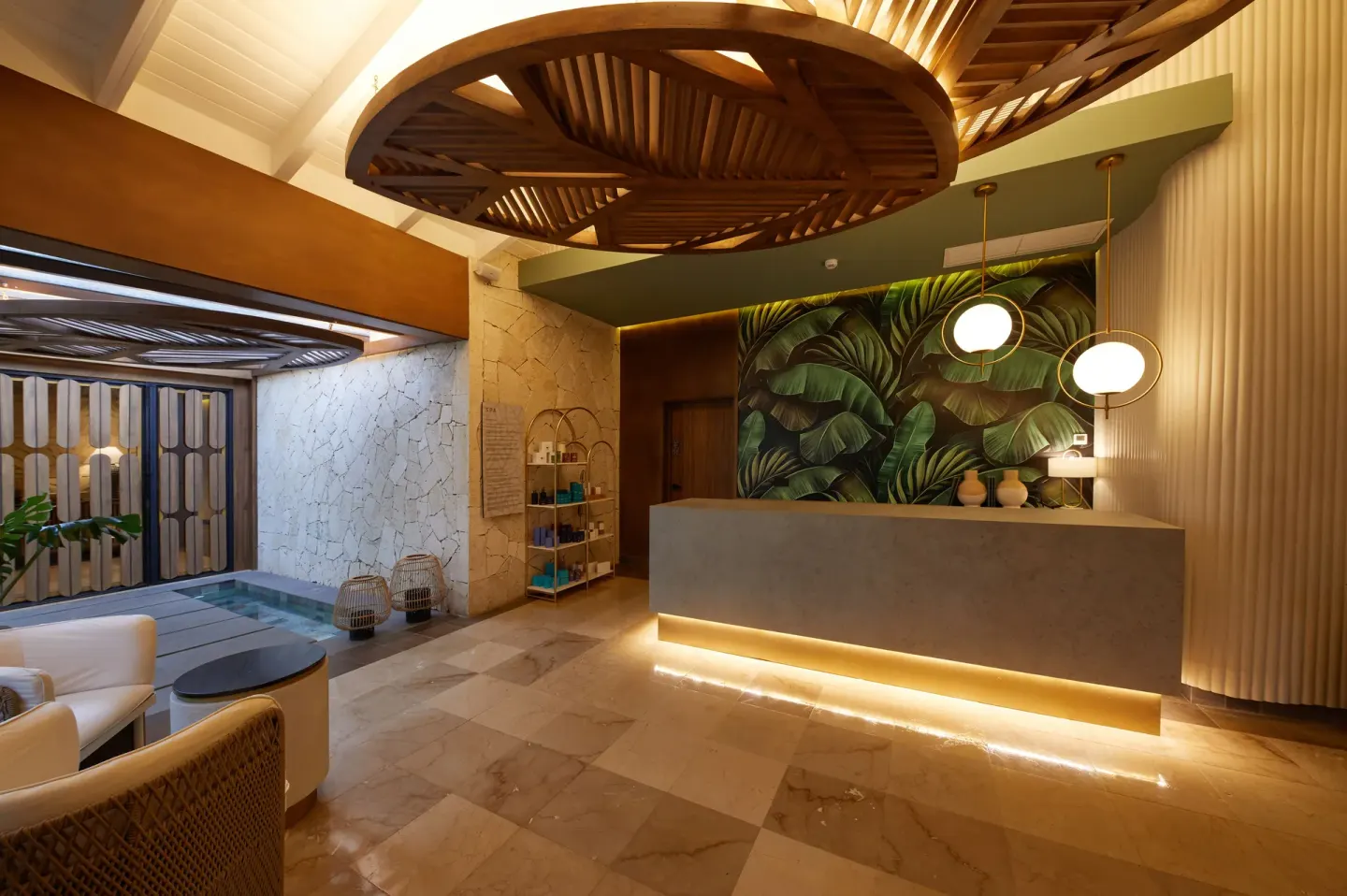 Spa reception desk with tropical wall décor at Cayo Levantado Resort.