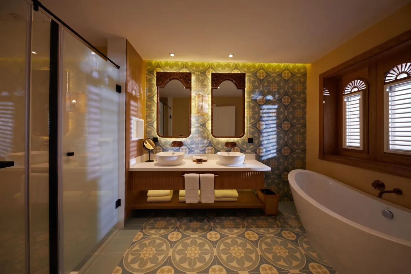 Junior Suite bathroom with soaking tub, shower and twin vanity at Cayo Levantado Resort.