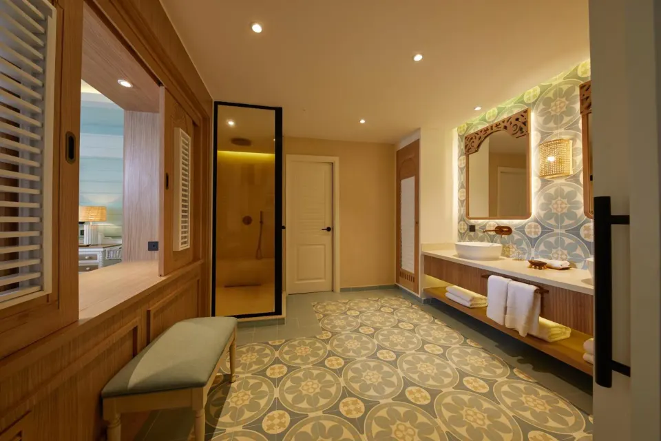 Junior Suite bathroom with vanity, shower and bedroom pass-through at Cayo Levantado Resort.
