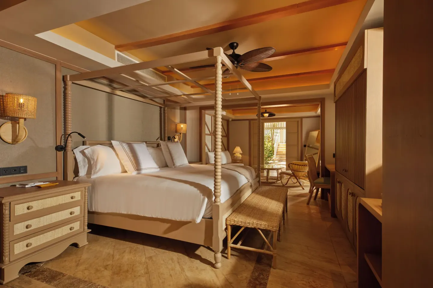 One Bedroom Villa king bed and warm wood furnishings at Cayo Levantado Resort.