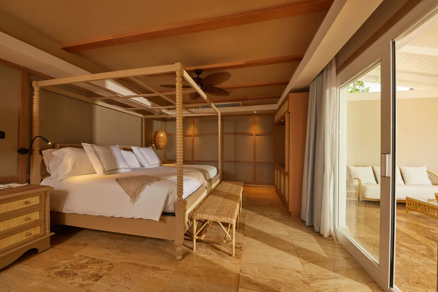 One Bedroom Villa king bed beside sliding terrace doors at Cayo Levantado Resort.