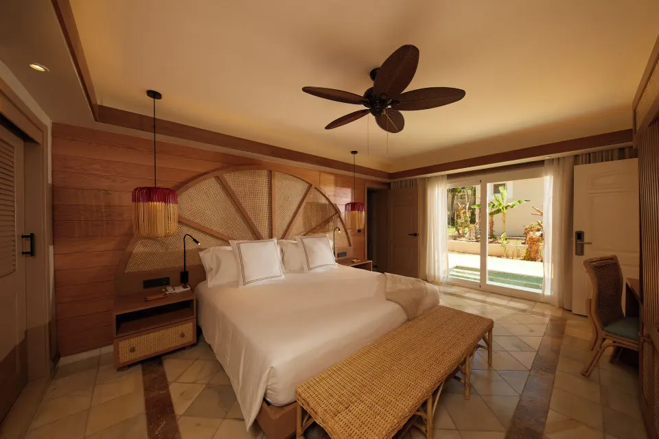 Villa 2 Bedrooms king bedroom with patio doors at Cayo Levantado Resort.
