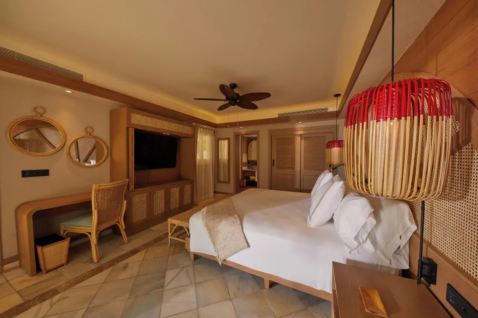 Villa 2 Bedrooms king bedroom with TV wall and desk at Cayo Levantado Resort.