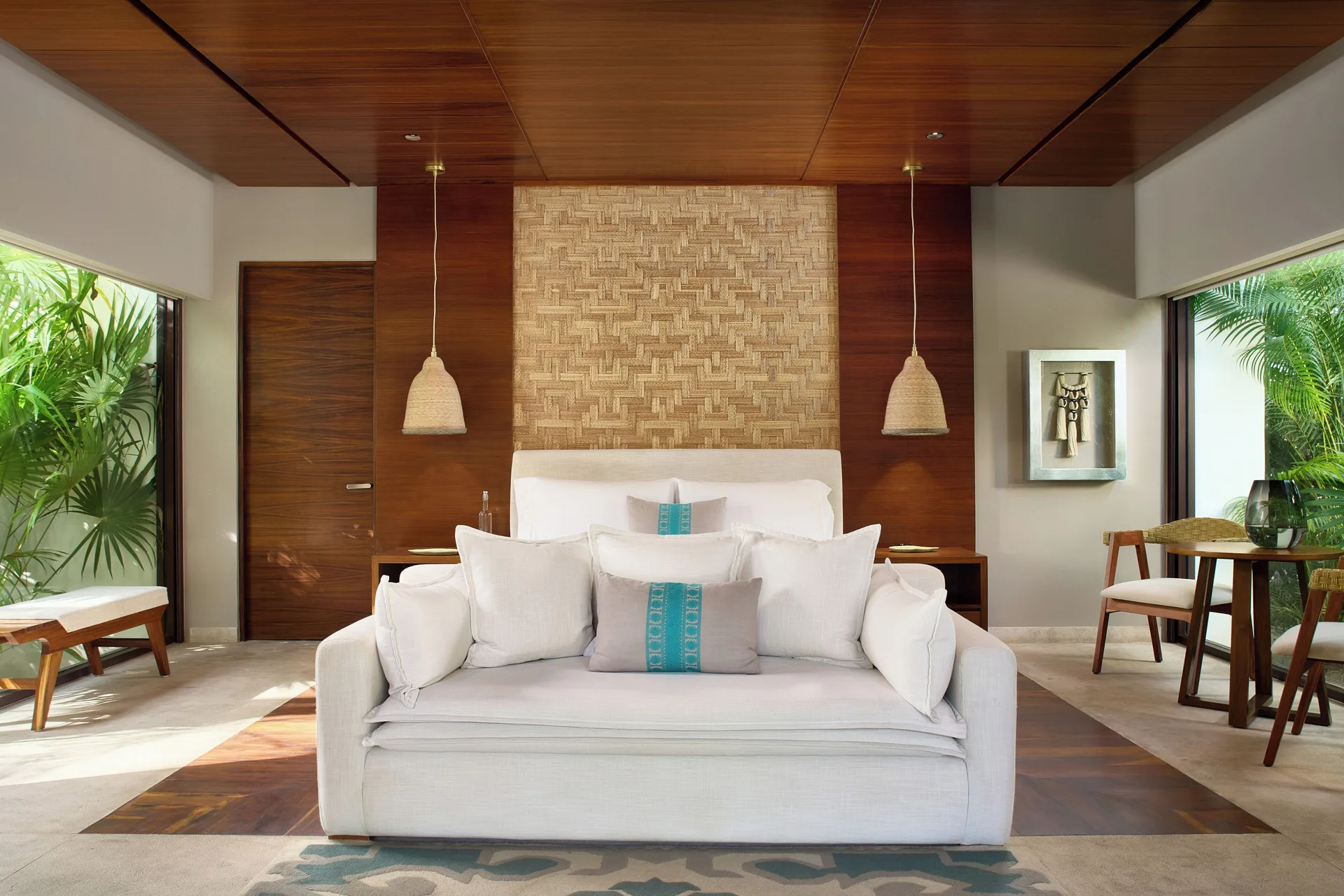 Serenity Pool Villa bedroom with sofa and king bed at Chablé Maroma.