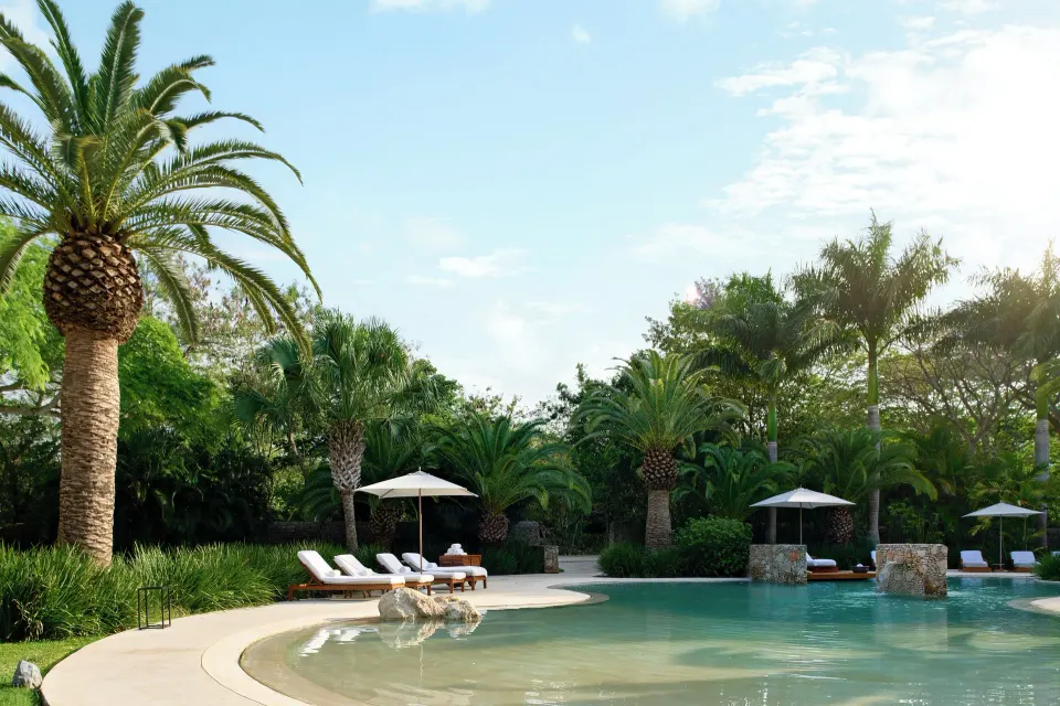 Shallow entry and sun loungers beside the tropical pool at Chablé Yucatán