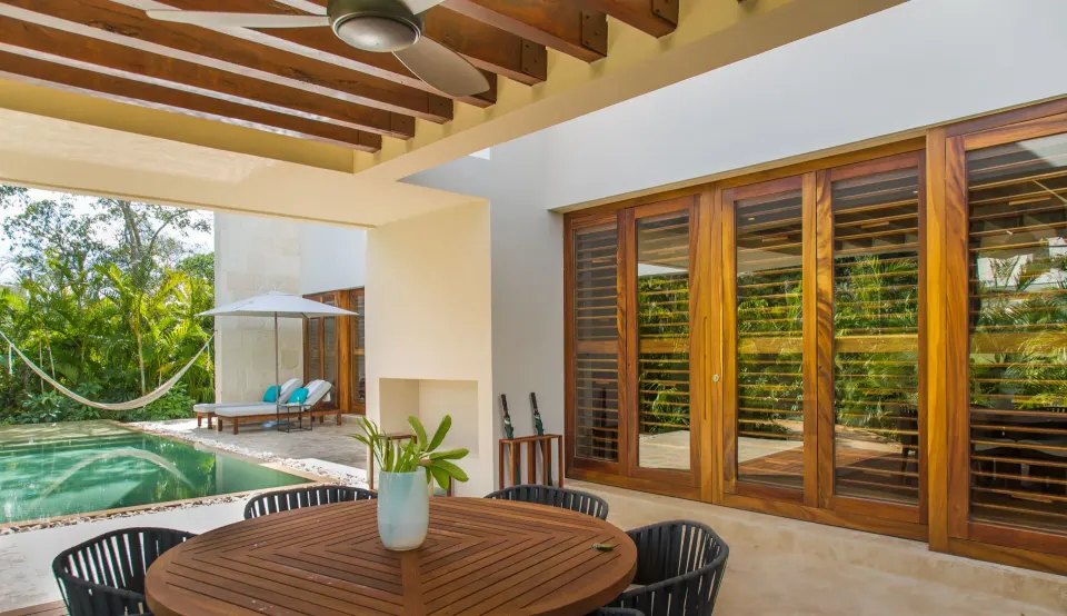 Private Family Villa pool terrace with hammock and shaded dining table at Chablé Yucatán