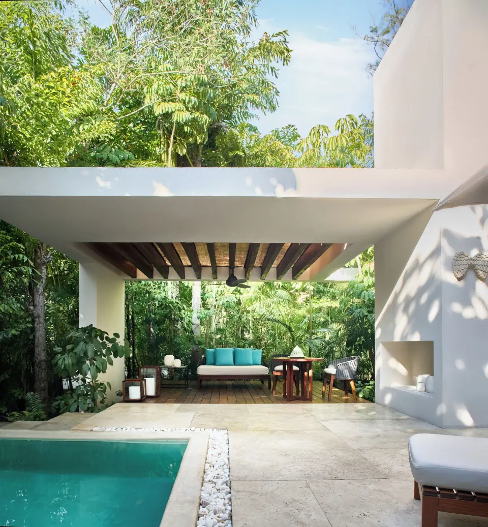 Private plunge pool and covered terrace of a Casita at Chablé Yucatán with turquoise daybed.